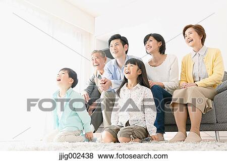 Three-generation Japanese family on the sofa in the living room View Large Photo Image Stock Photo - Three-generation Japanese family on the sofa in the living room. Fotosearch