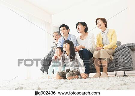 Three-generation Japanese family on the sofa in the living room View Large Photo Image Stock Photograph - Three-generation Japanese family on the sofa in the living room. Fotosearch