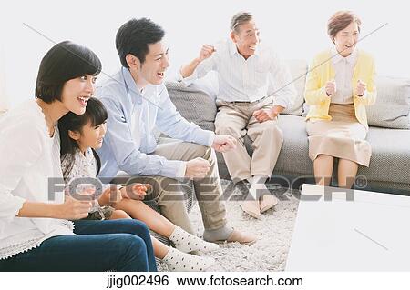 Three-generation Japanese family on the sofa in the living room View Large Photo Image Stock Photograph - Three-generation Japanese family on the sofa in the living room. Fotosearch