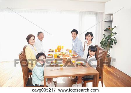 Stock Photo - Three-generation Japanese family together in the kitchen. Fotosearch
