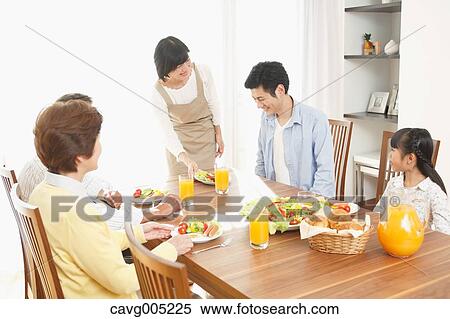 Stock Photography - Three-generation Japanese family together in the kitchen. Fotosearch