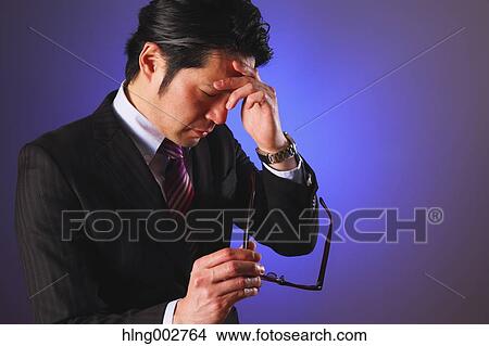 Tired Japanese businessman View Large Photo Image Picture - Tired Japanese businessman. Fotosearch