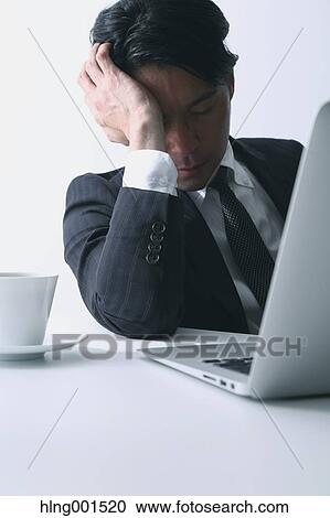 Tired Japanese businessman View Large Photo Image Stock Image - Tired Japanese businessman. Fotosearch