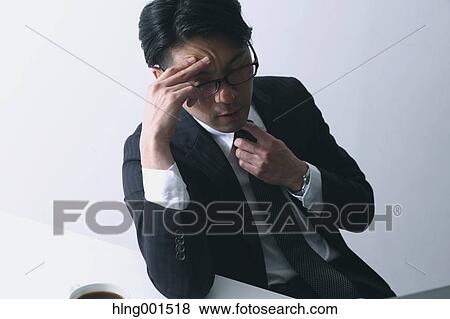Tired Japanese businessman View Large Photo Image Stock Photo - Tired Japanese businessman. Fotosearch