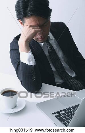 Tired Japanese businessman View Large Photo Image Stock Photo - Tired Japanese businessman. Fotosearch