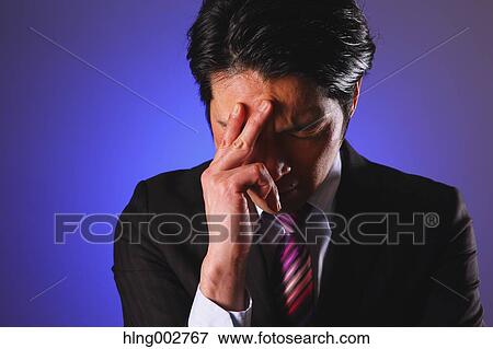 Tired Japanese businessman View Large Photo Image Stock Photo - Tired Japanese businessman. Fotosearch