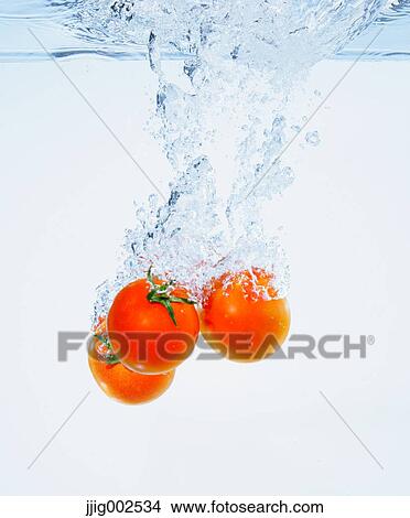 Tomatoes in water View Large Photo Image Picture - Tomatoes in water. Fotosearch
