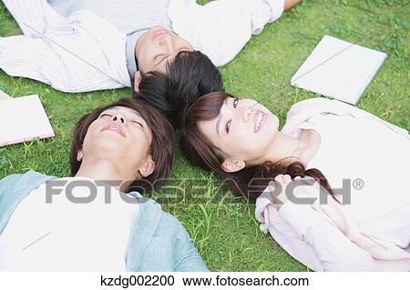 Stock Image - University student in the campus park. Fotosearch
