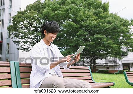 University student in the campus park View Large Photo Image Stock Image - University student in the campus park. Fotosearch