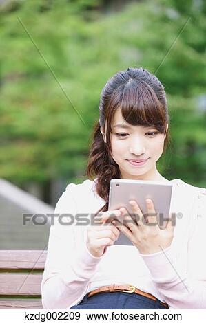 University student in the campus park View Large Photo Image Stock Photo - University student in the campus park. Fotosearch