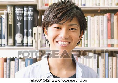 University student in the library View Large Photo Image Stock Image - University student in the library. Fotosearch