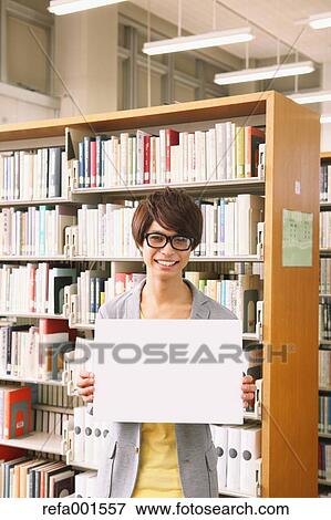 University student in the library View Large Photo Image Stock Photo - University student in the library. Fotosearch