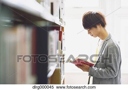 University student in the library View Large Photo Image Stock Photography - University student in the library. Fotosearch