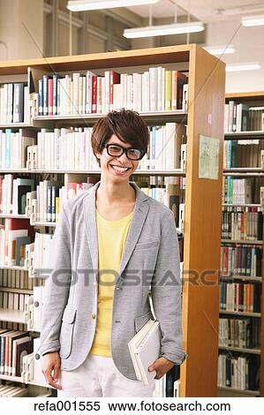 University student in the library View Large Photo Image Stock Photography - University student in the library. Fotosearch