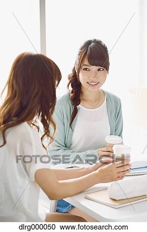Stock Image - University student in the school cafe. Fotosearch