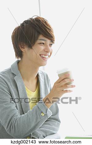 Stock Image - University student in the school cafe. Fotosearch