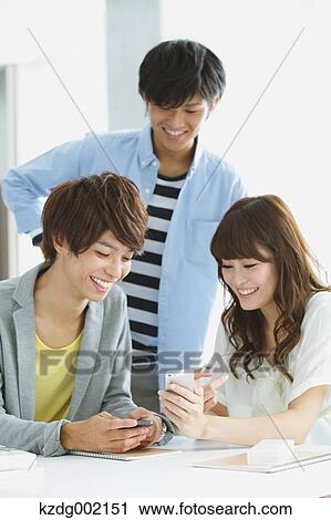 Stock Image - University student in the school cafe. Fotosearch
