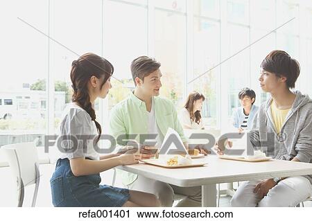 Stock Image - University student in the school cafe. Fotosearch