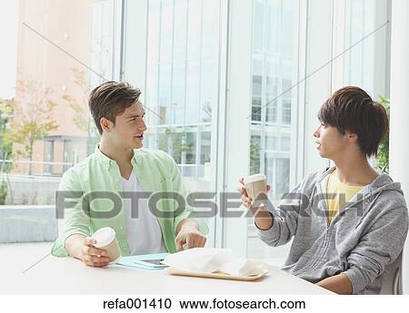 Stock Image - University student in the school cafe. Fotosearch