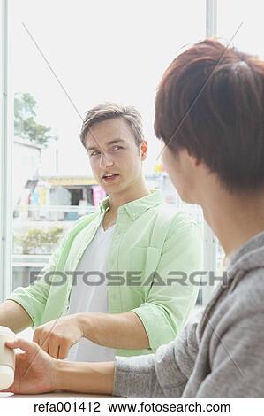 Stock Image - University student in the school cafe. Fotosearch
