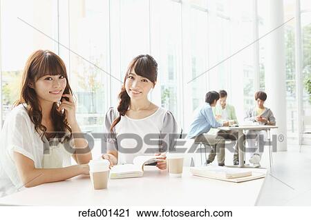 Stock Image - University student in the school cafe. Fotosearch
