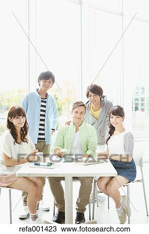 Stock Image - University student in the school cafe. Fotosearch