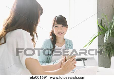 Stock Image - University student in the school cafe. Fotosearch