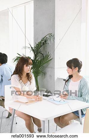 Stock Image - University student in the school cafe. Fotosearch