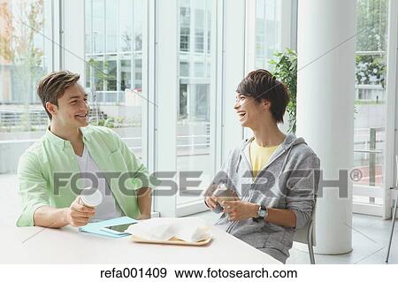 Stock Photo - University student in the school cafe. Fotosearch