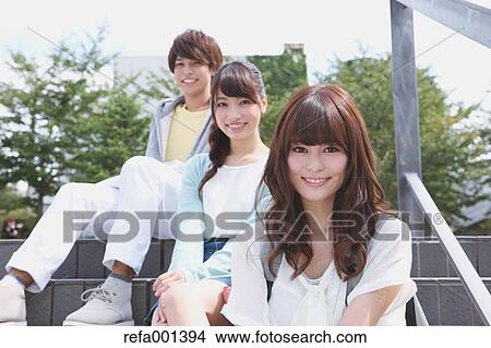 Picture - University students in the campus park. Fotosearch