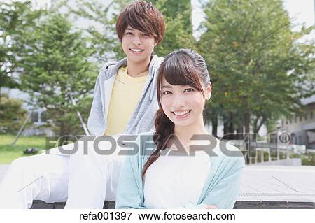 University students in the campus park View Large Photo Image Stock Photo - University students in the campus park. Fotosearch