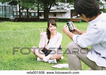 University students in the campus park View Large Photo Image Stock Photo - University students in the campus park. Fotosearch
