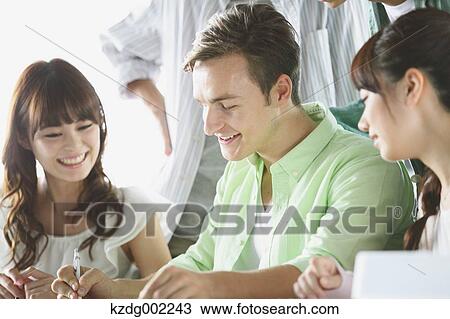 Stock Image - University students in the classroom. Fotosearch