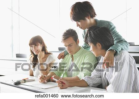 Stock Image - University students in the classroom. Fotosearch