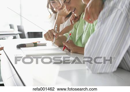Stock Image - University students in the classroom. Fotosearch