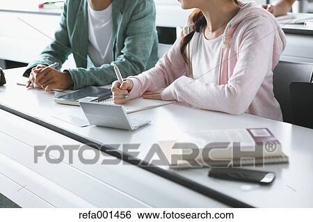 Stock Photograph - University students in the classroom. Fotosearch