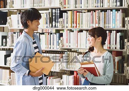 Picture - University students in the library. Fotosearch