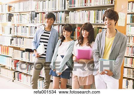 Picture - University students in the library. Fotosearch