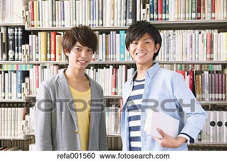 University students in the library View Large Photo Image Stock Image - University students in the library. Fotosearch