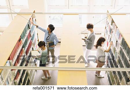 University students in the library View Large Photo Image Stock Image - University students in the library. Fotosearch