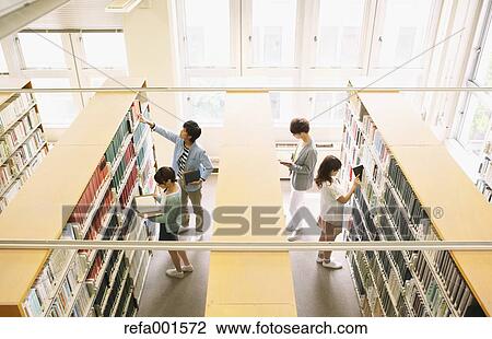 University students in the library View Large Photo Image Stock Image - University students in the library. Fotosearch
