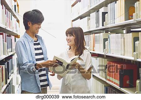 Stock Photo - University students in the library. Fotosearch