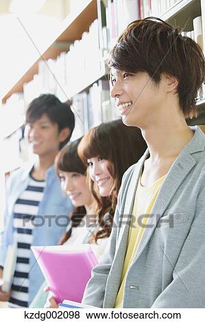 Stock Photo - University students in the library. Fotosearch