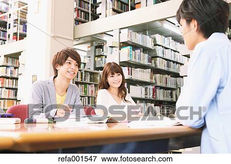 University students in the library View Large Photo Image Stock Photo - University students in the library. Fotosearch