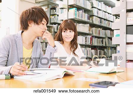 University students in the library View Large Photo Image Stock Photo - University students in the library. Fotosearch