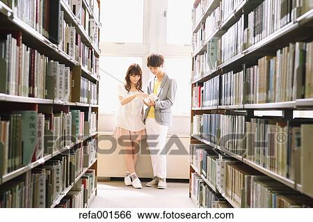 University students in the library View Large Photo Image Stock Photograph - University students in the library. Fotosearch