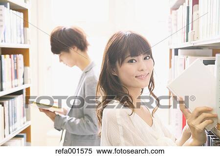 Stock Photography - University students in the library. Fotosearch