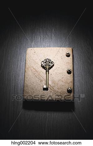 Picture - Vintage key and book. Fotosearch