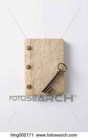 Stock Image - Vintage key and book. Fotosearch