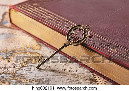 Stock Image - Vintage key and book. Fotosearch